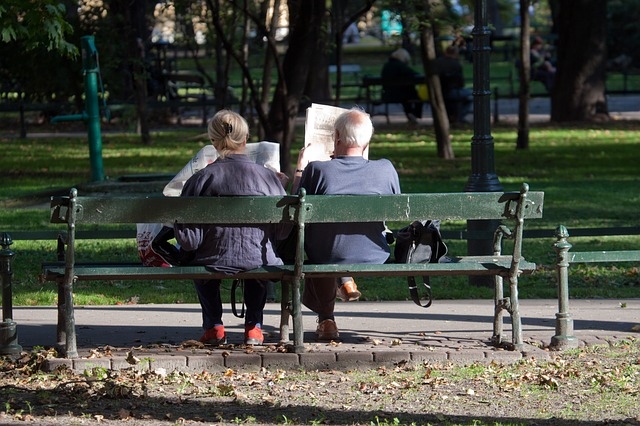 French Tourists Reading Newspaper